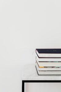 kaboompics Books On Marble Table White Background